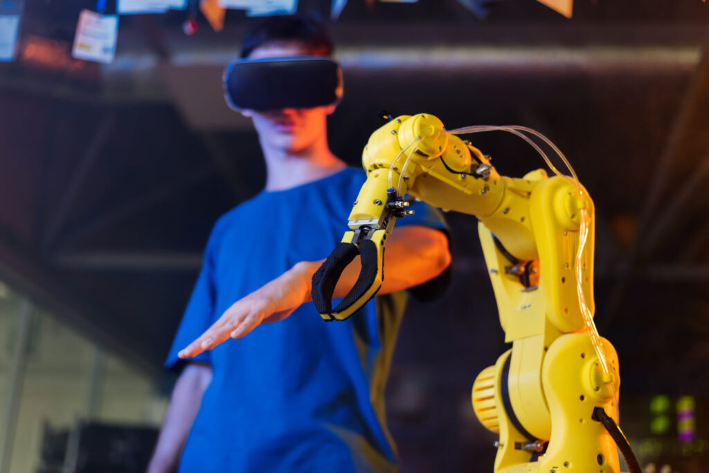 Teen remotely controlling robots in a laboratory